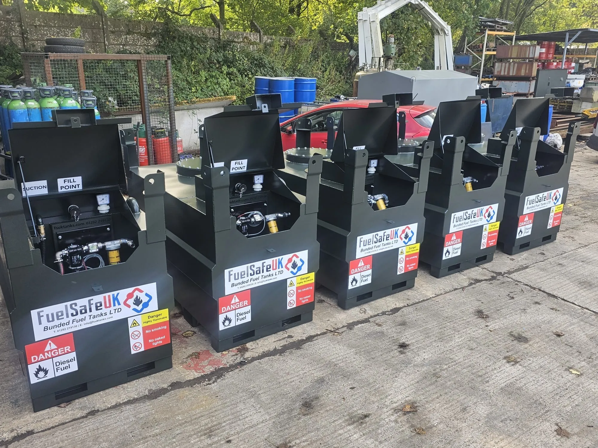 Row of 1,350 litre Fuel Safe Cube bunded fuel tanks with pumps fitted
