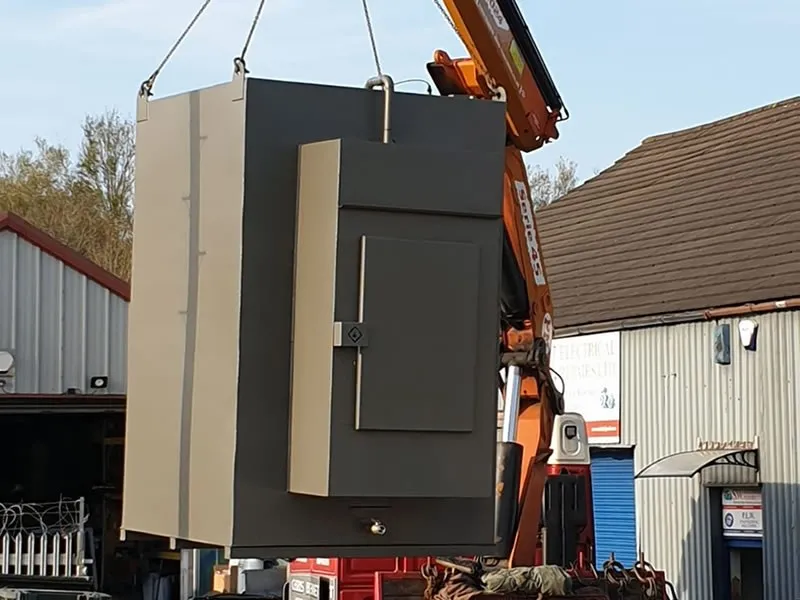 Domestic bunded fuel tank being lifted into place by crane