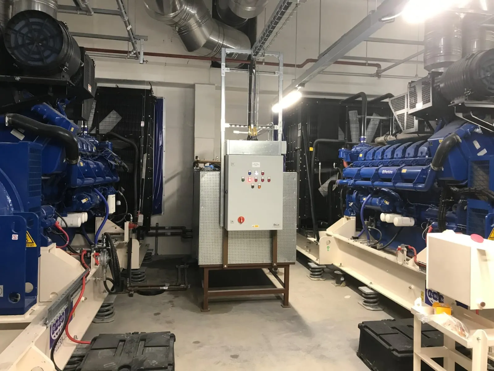 Generator feed tank installed beside standby generators in a plant room