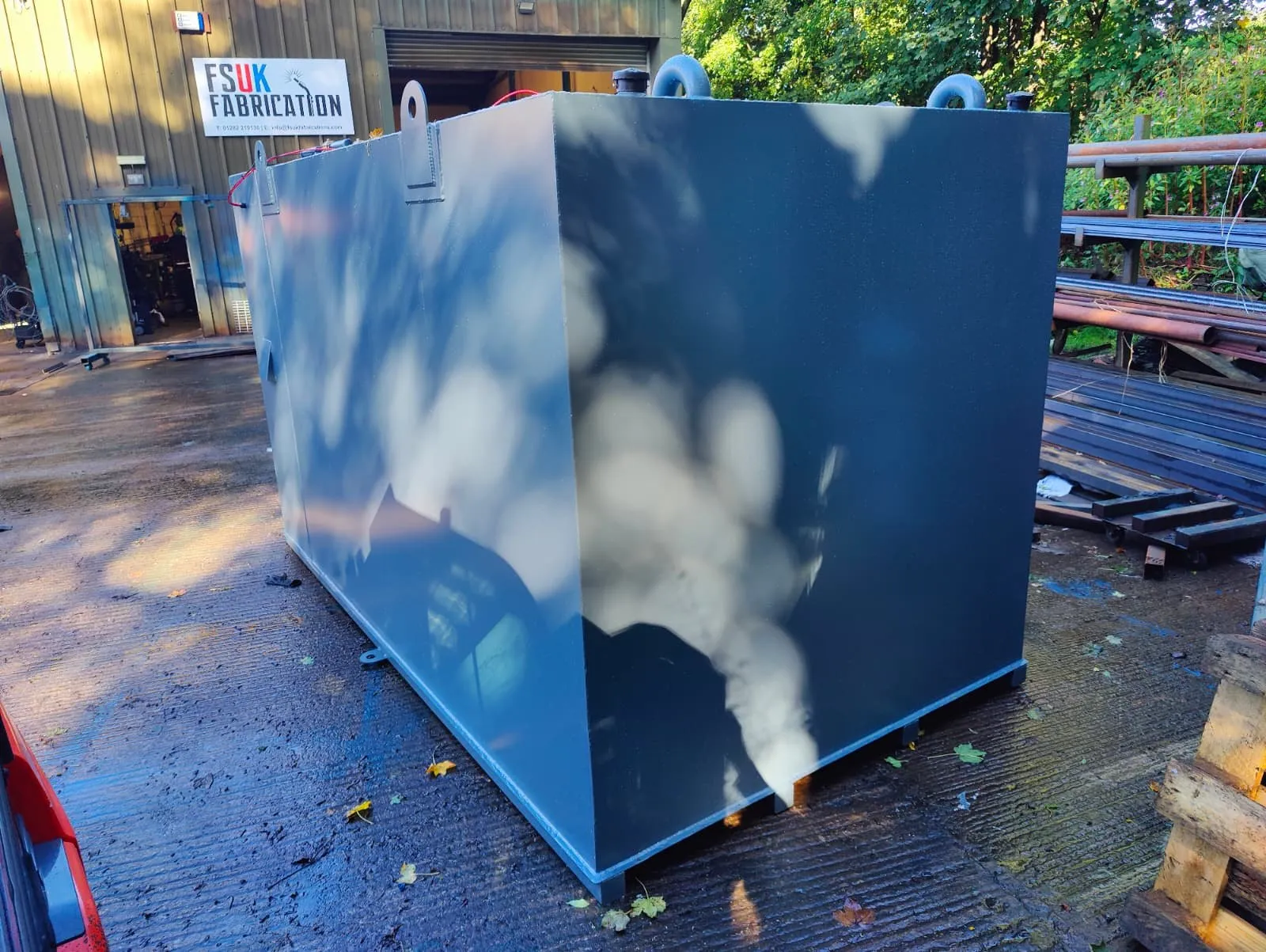 Side of a 10,000L bunded generator feed tank built to fit a shipping container