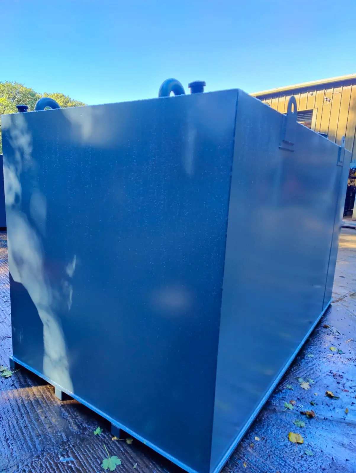 Rear corner of a GFE Power Products bunded generator feed tank in blue grey