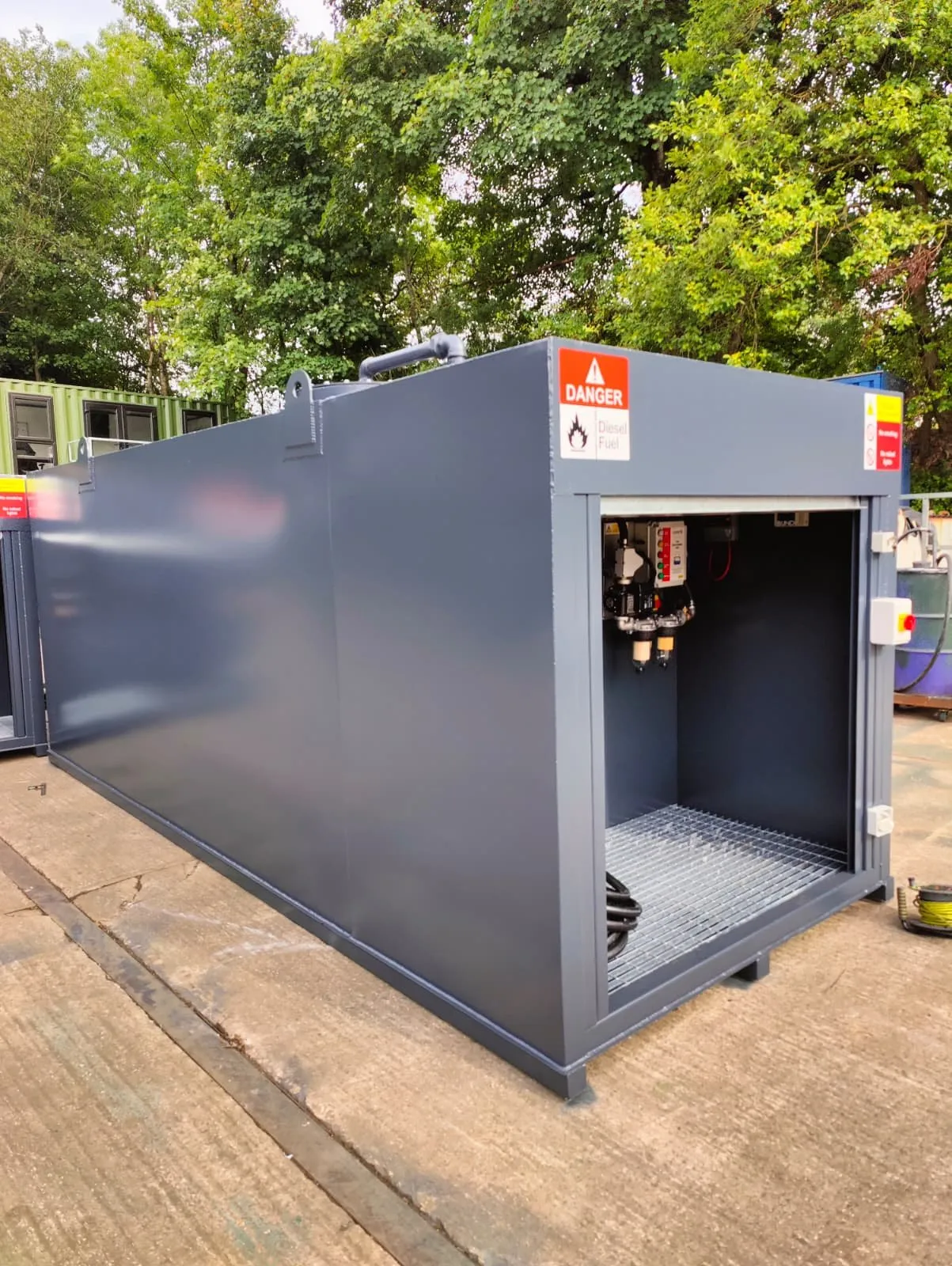Second 14,000L bunded diesel tank for Netwise in anthracite grey with roller shutter cabinet
