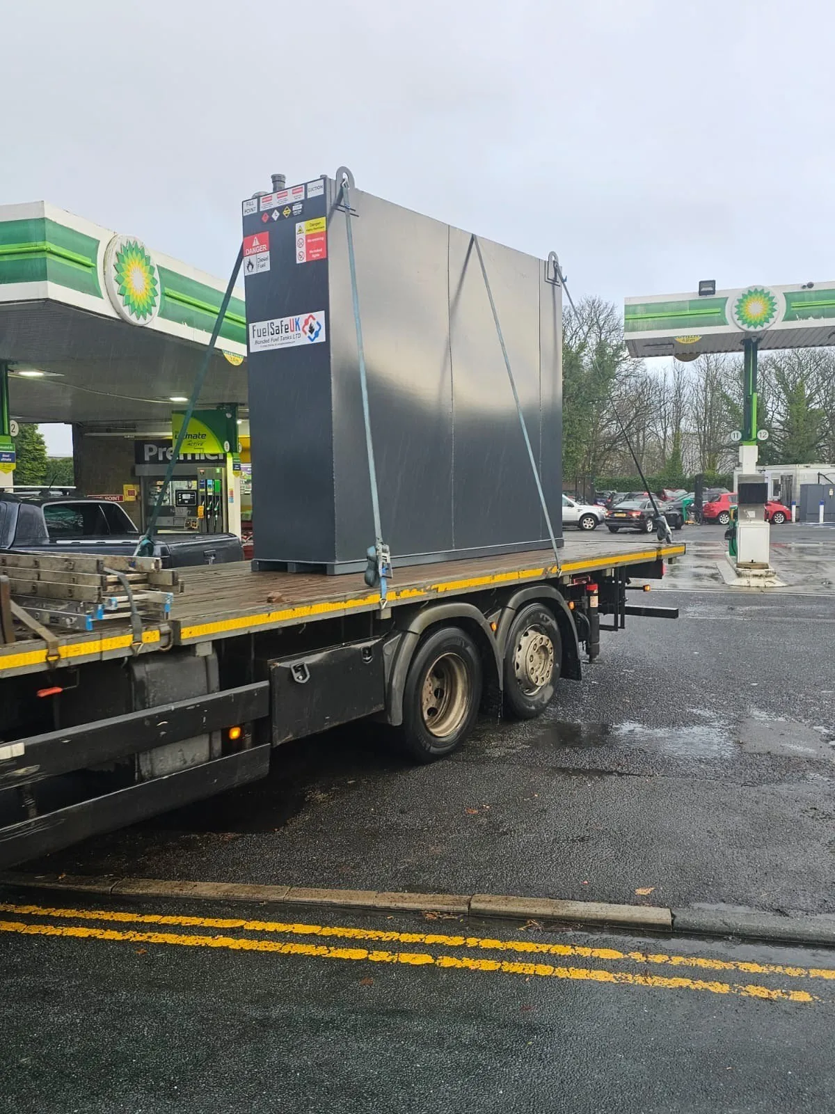Bunded fuel tank delivered by lorry to a fuel forecourt